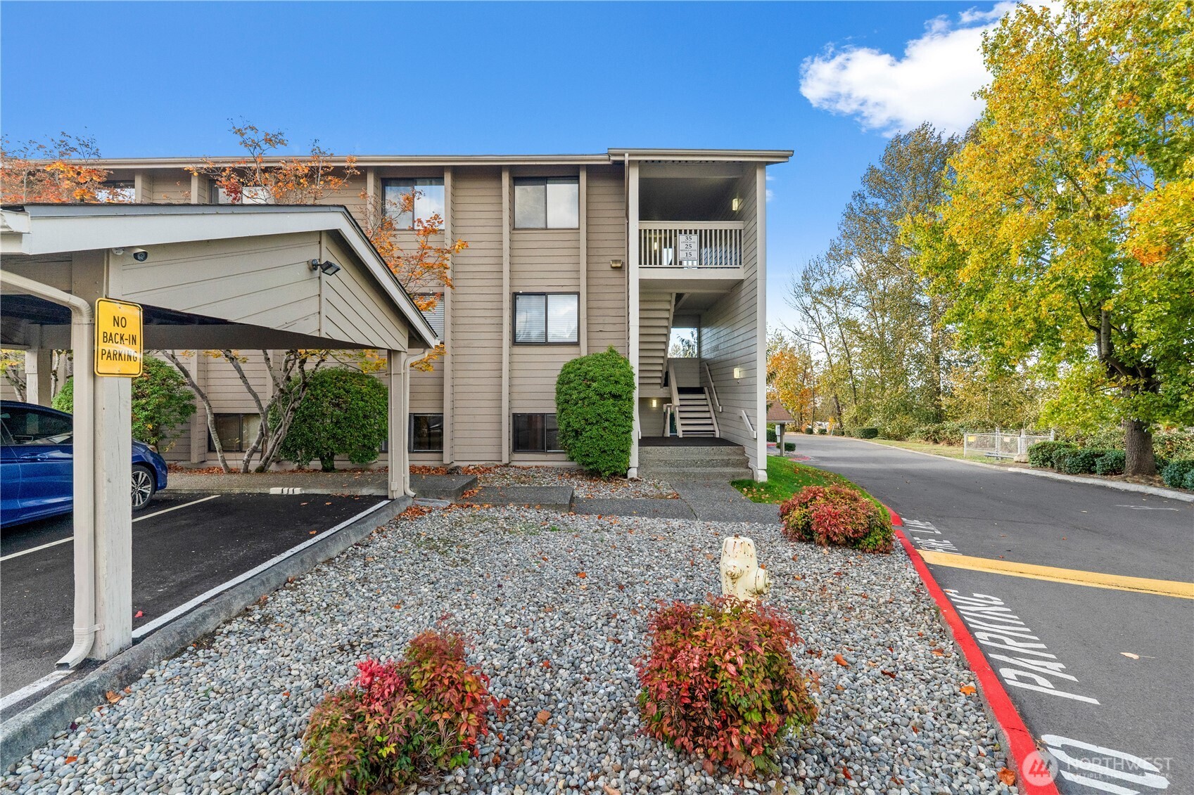 1321 South Puget Drive, Unit E15 Renton, WA 98055 - Photo 26 of 30 a front view of a house with garden