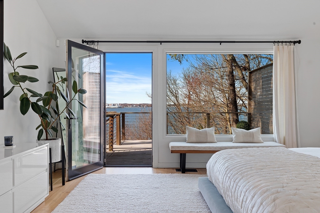 23 Pinecliff Drive Marblehead, MA 01945 - Photo 14 of 41 a bedroom with a bed and a large window with outer view