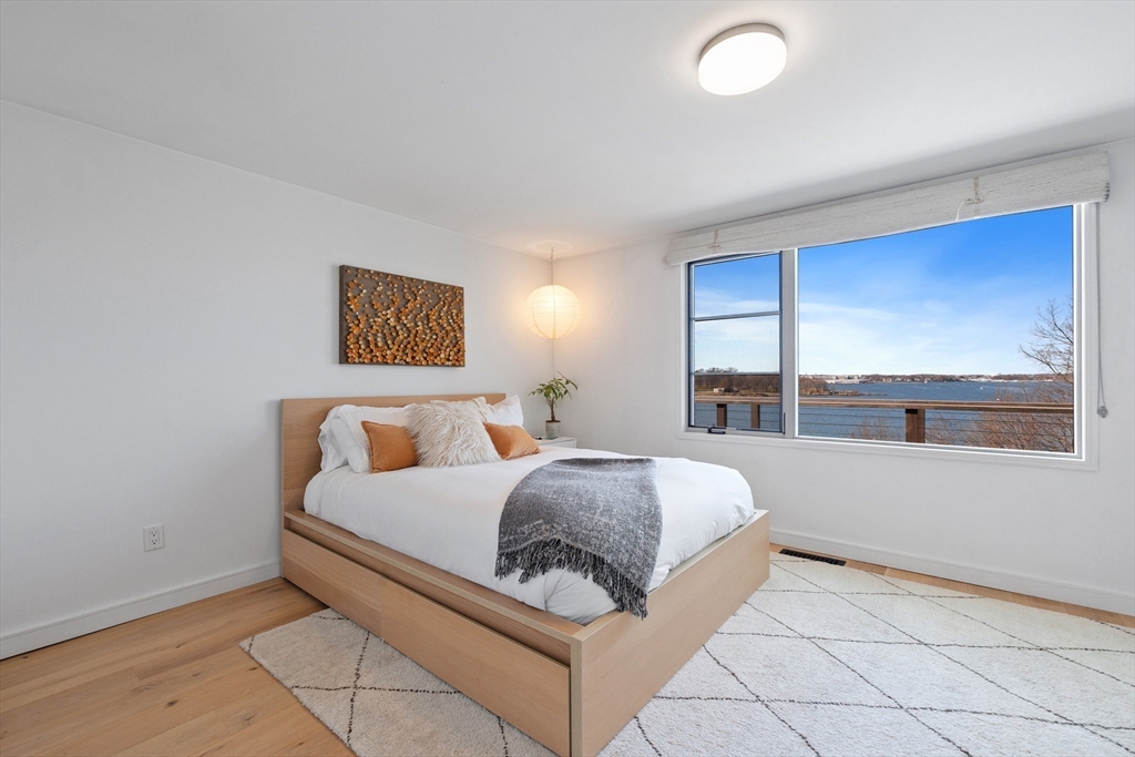 23 Pinecliff Drive Marblehead, MA 01945 - Photo 17 of 41 a bed room with a bed and a large window