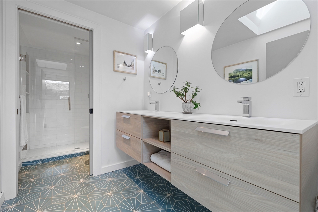 23 Pinecliff Drive Marblehead, MA 01945 - Photo 18 of 41 a bathroom with a mirror and a sink