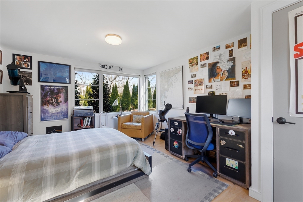 23 Pinecliff Drive Marblehead, MA 01945 - Photo 19 of 41 a living room with furniture a flat screen tv and a floor to ceiling window