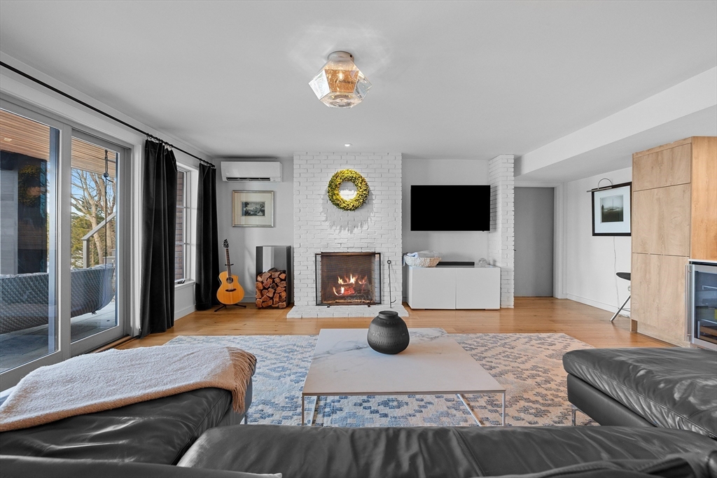 23 Pinecliff Drive Marblehead, MA 01945 - Photo 20 of 41 a living room with furniture and a fireplace