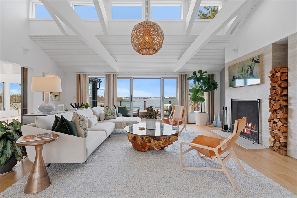 23 Pinecliff Drive Marblehead, MA 01945 - Photo 2 of 41 a living room with furniture a table and a fireplace