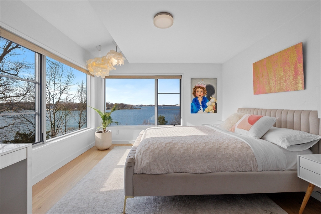 23 Pinecliff Drive Marblehead, MA 01945 - Photo 22 of 41 a bedroom with a large bed and a large window