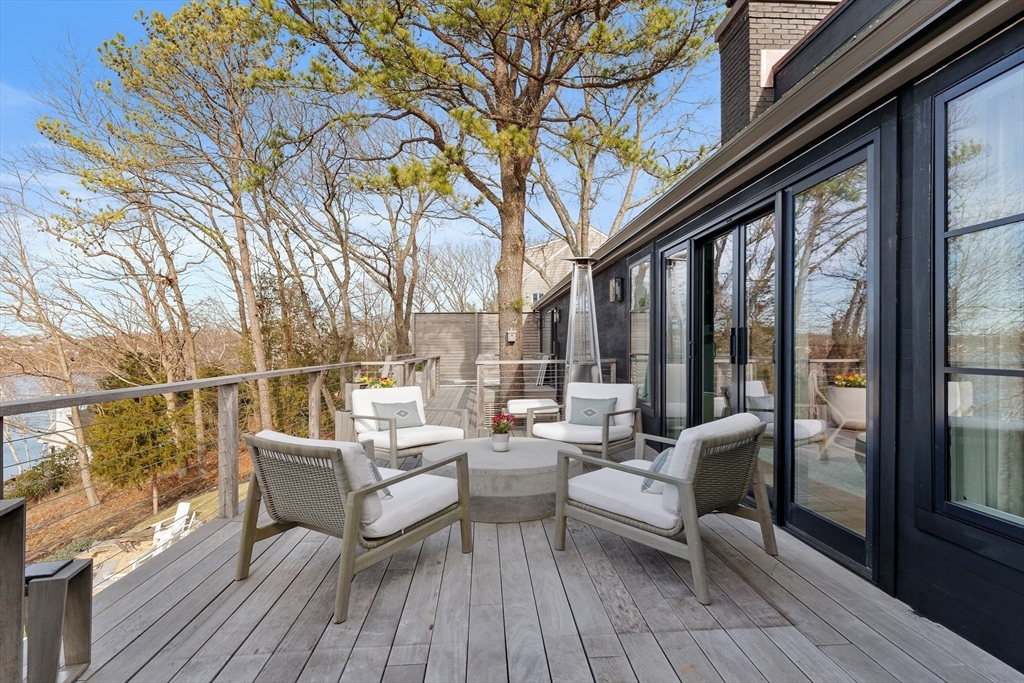 23 Pinecliff Drive Marblehead, MA 01945 - Photo 26 of 41 a balcony with furniture and wooden floor