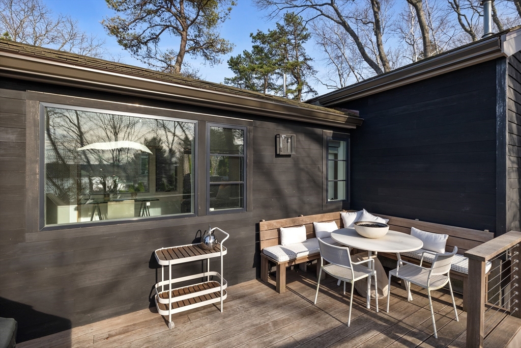 23 Pinecliff Drive Marblehead, MA 01945 - Photo 27 of 41 a backyard of a house with table and chairs