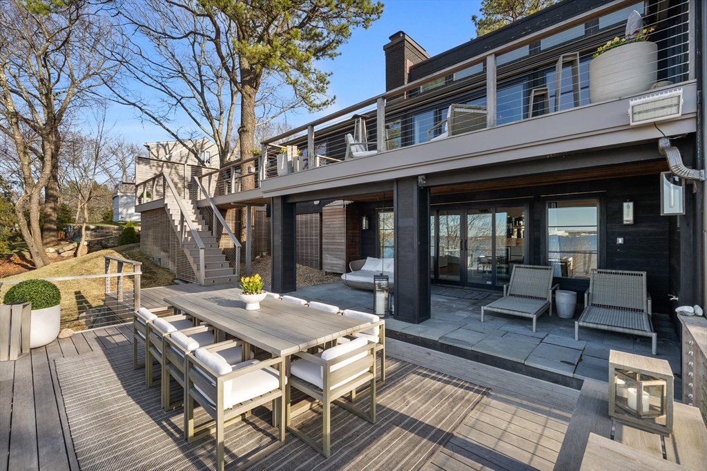 23 Pinecliff Drive Marblehead, MA 01945 - Photo 30 of 41 a view of a patio with couches table and chairs and wooden floor