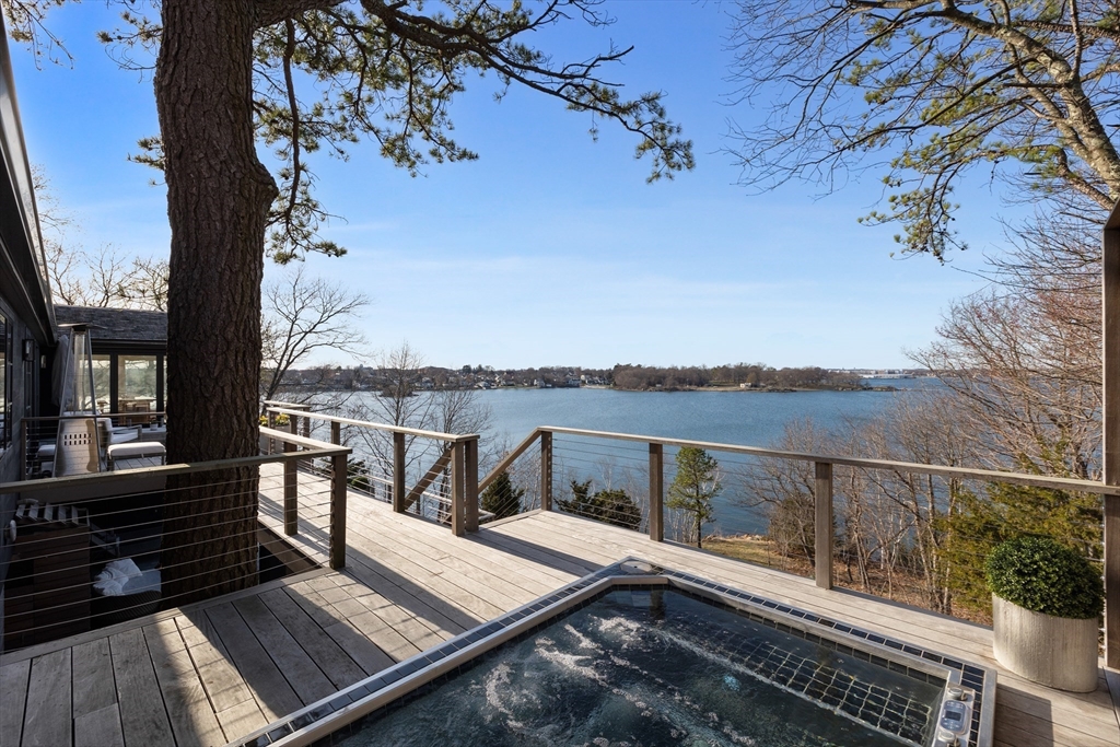 23 Pinecliff Drive Marblehead, MA 01945 - Photo 31 of 41 a view of a balcony with two chairs and a table