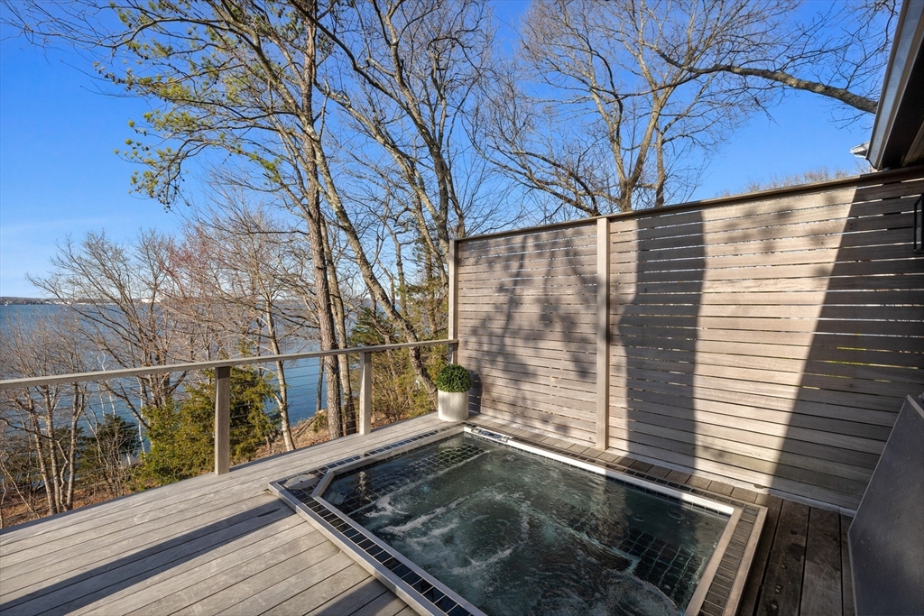 23 Pinecliff Drive Marblehead, MA 01945 - Photo 32 of 41 a view of a backyard with a large tree