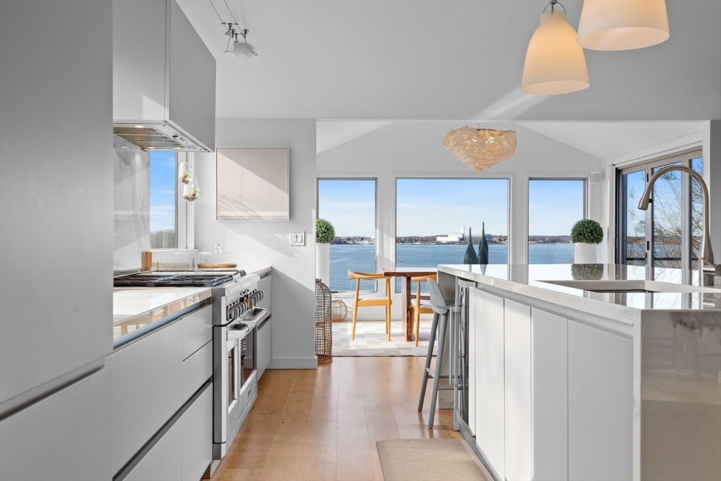 23 Pinecliff Drive Marblehead, MA 01945 - Photo 6 of 41 a kitchen with stainless steel appliances granite countertop a stove and a sink