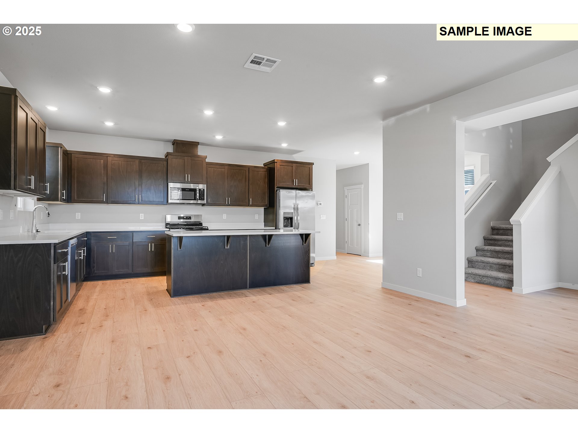 1036 Legacy Street Eugene, OR 97402 - Photo 3 of 18 a large kitchen with stainless steel appliances lots of counter top space