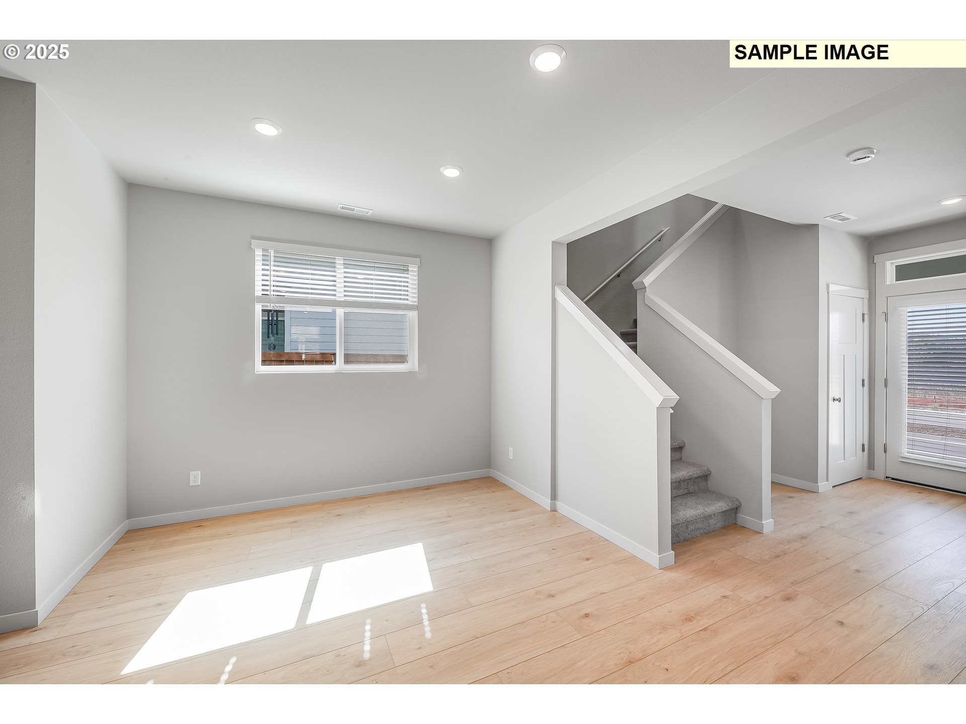 1036 Legacy Street Eugene, OR 97402 - Photo 9 of 18 a view of an empty room with wooden floor and stairs