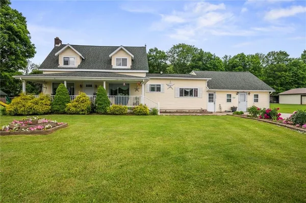 a front view of house with yard and green space