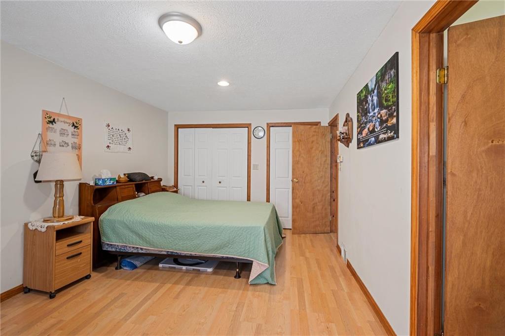 500 Kinsman Road Jamestown, PA 16134 - Photo 16 of 43 a bedroom with a bed and wooden floor