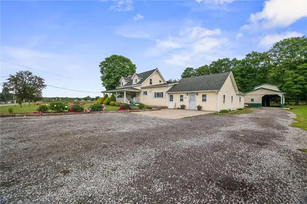 a view of a house with a yard