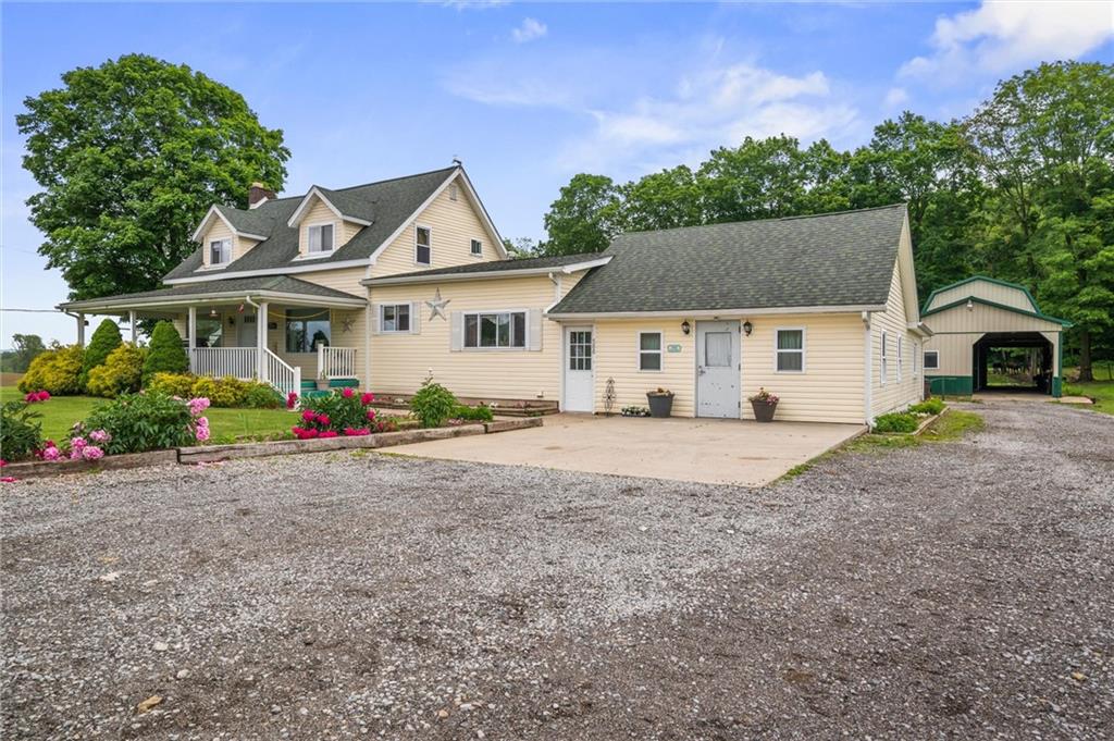 500 Kinsman Road Jamestown, PA 16134 - Photo 36 of 43 a view of a white house with a yard and plants