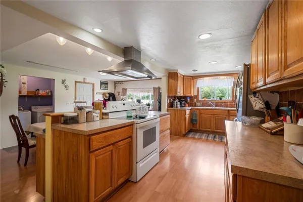 a kitchen with stainless steel appliances granite countertop lots of counter top space