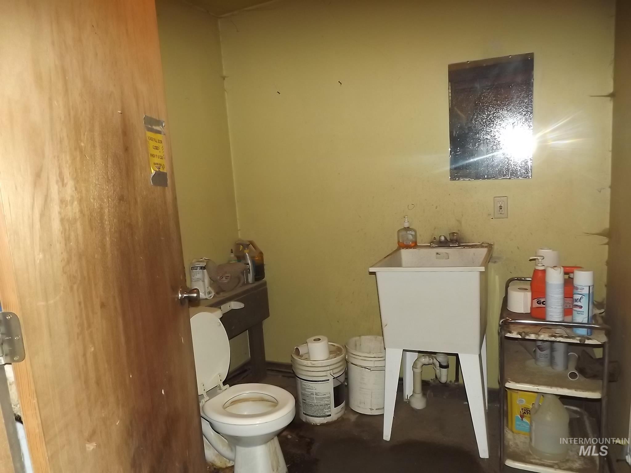 414 Wood Street Weippe, ID 83553 - Photo 34 of 46 Half bath with toilet and vanity