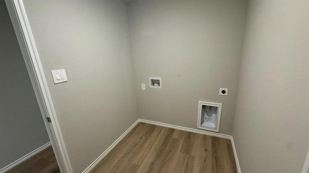 5541 Flannel Lane Krum, TX 76249 - Photo 9 of 13 a view of a small space with wooden floor and a window