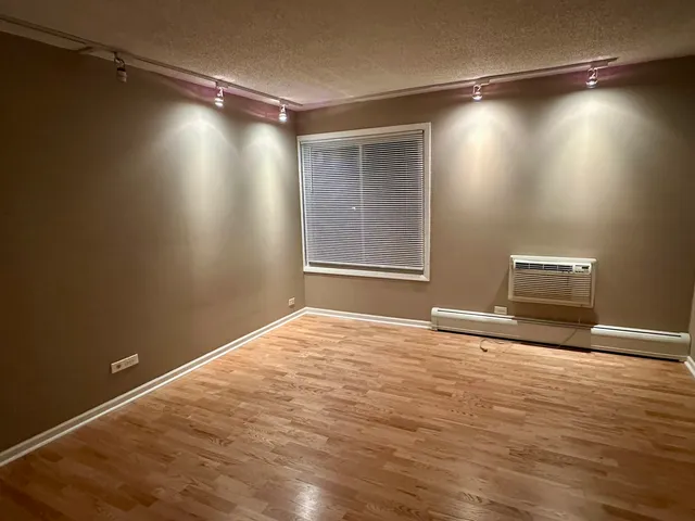 a view of an empty room and a window