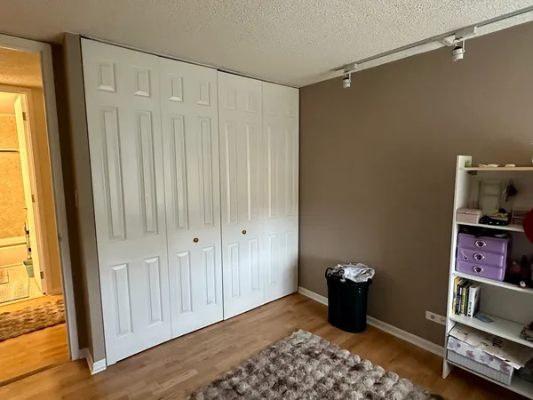 a bathroom with a sink mirror vanity and toilet