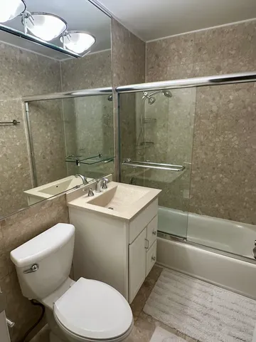 a view of a livingroom with furniture and entryway