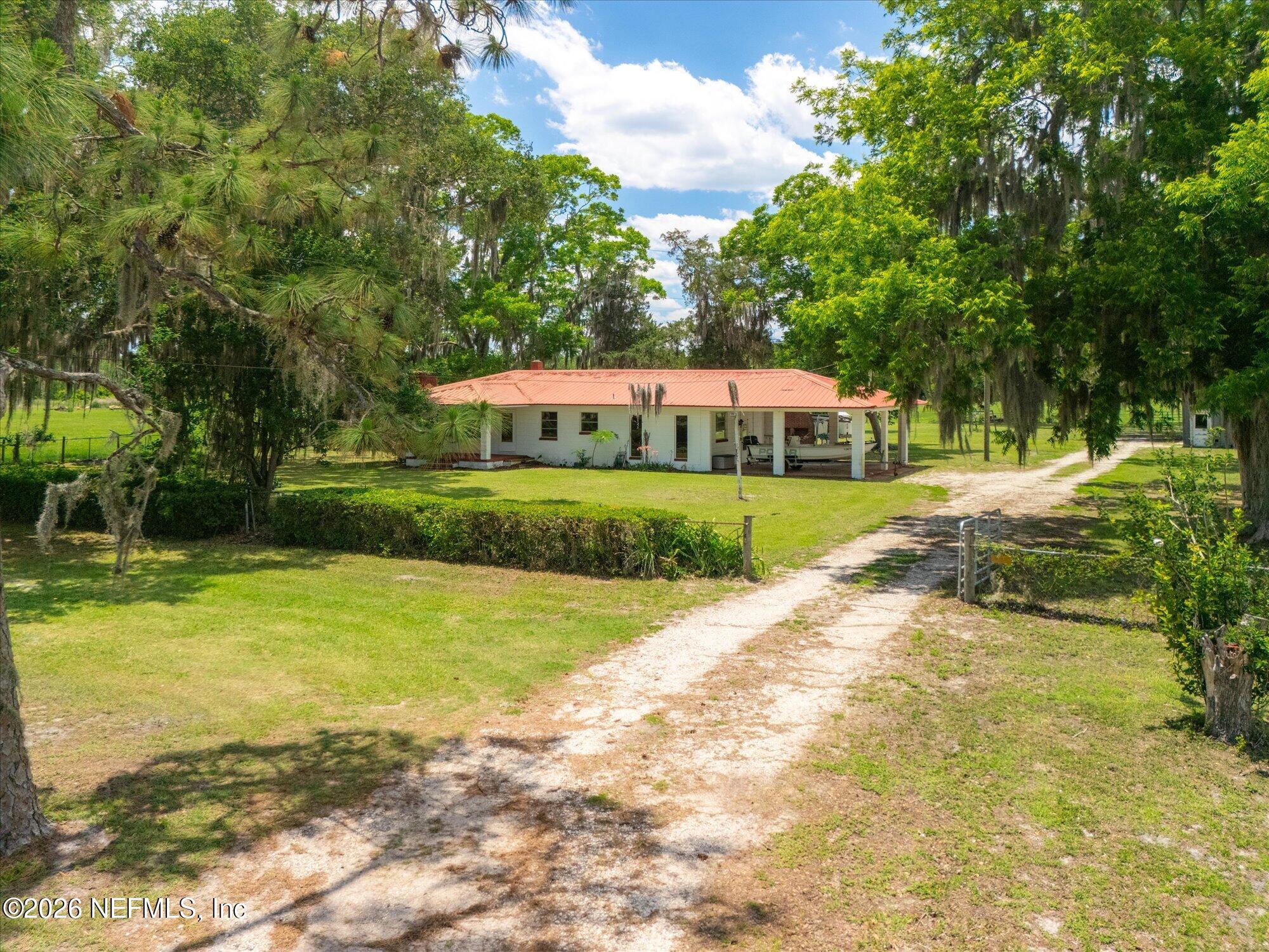 786 West River Road Palatka, FL 32177 - Photo 35 of 53 a front view of a house with a yard