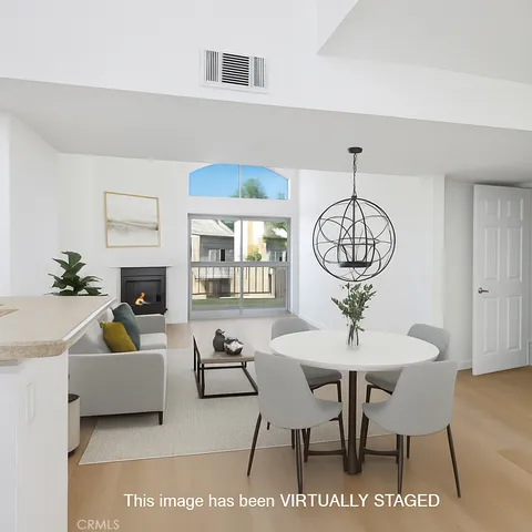 a view of a dining room with furniture and chandelier