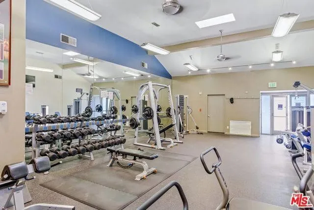 a view of a room with wooden cabinets
