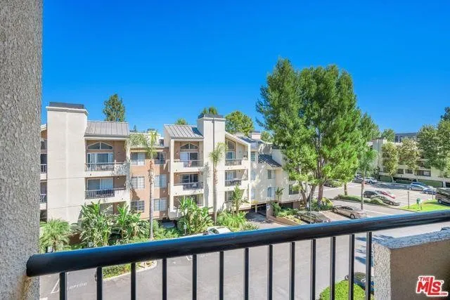 a spacious bedroom with a bed and a large window