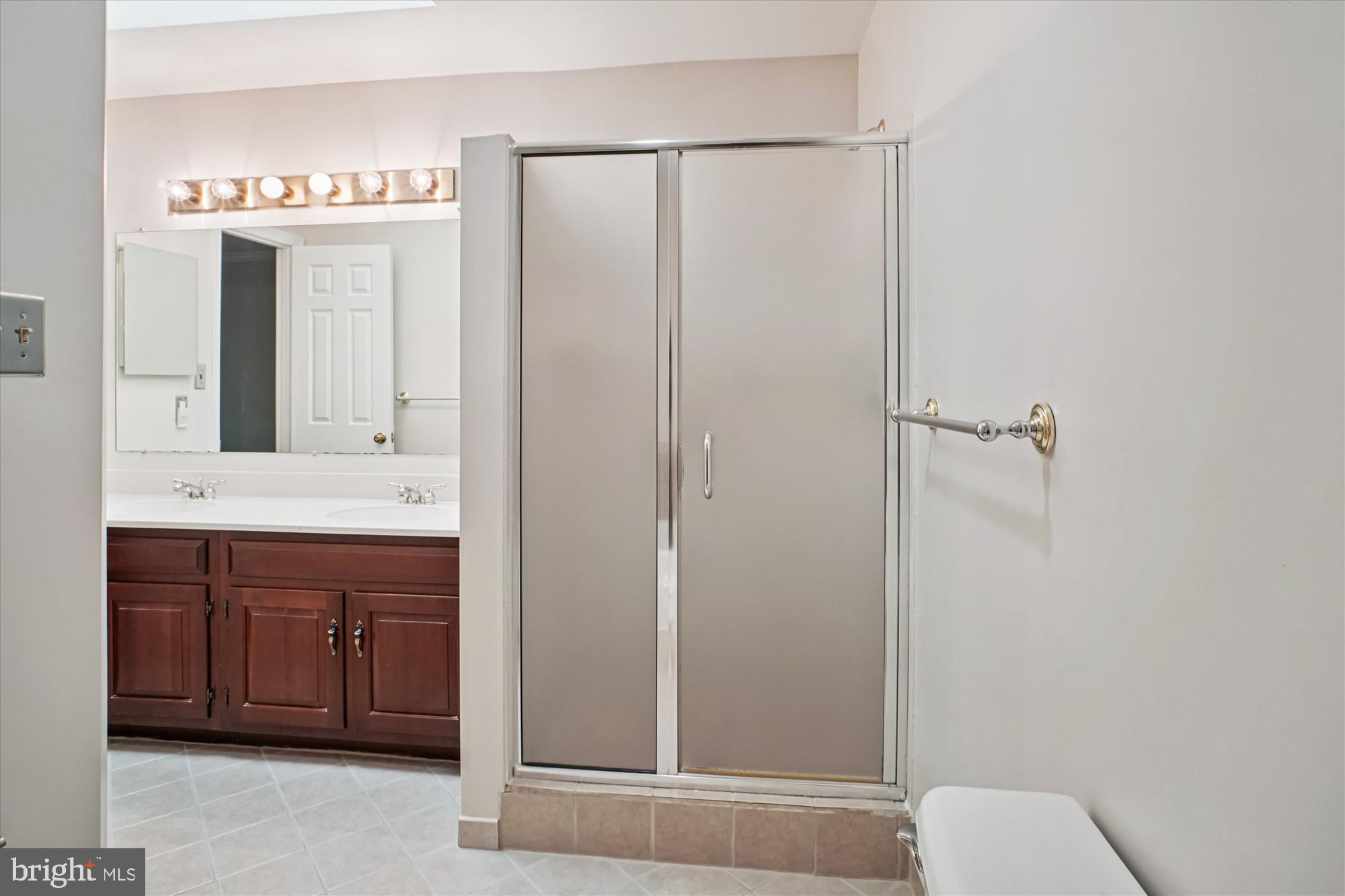 2697 Marcey Road Arlington, VA 22207 - Photo 30 of 64 a bathroom with a double vanity sink and mirror