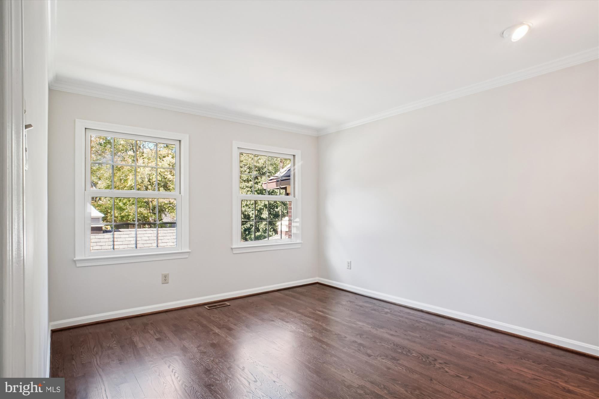 2697 Marcey Road Arlington, VA 22207 - Photo 36 of 64 an empty room with wooden floor and windows