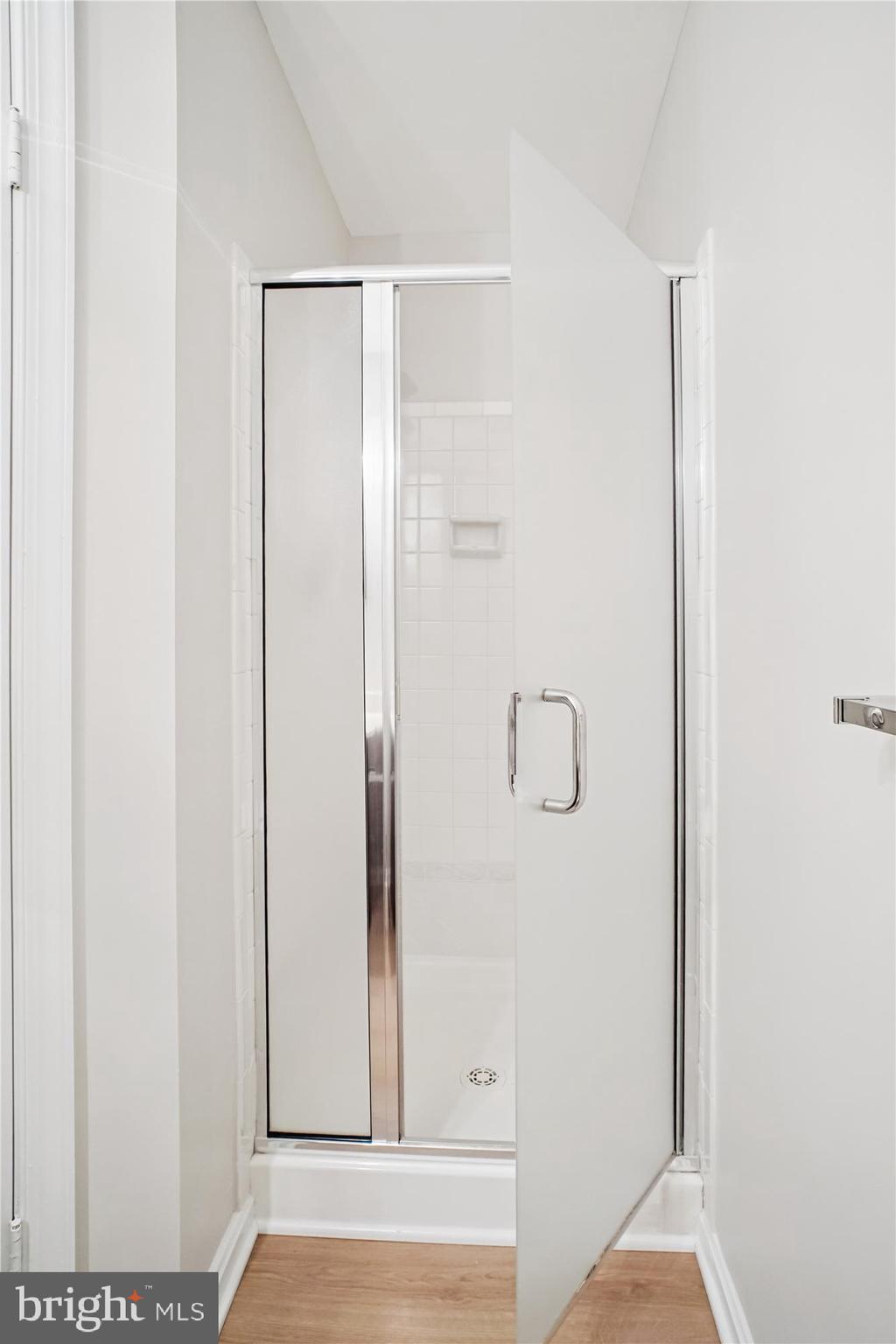 2697 Marcey Road Arlington, VA 22207 - Photo 43 of 64 a bathroom with a glass shower door