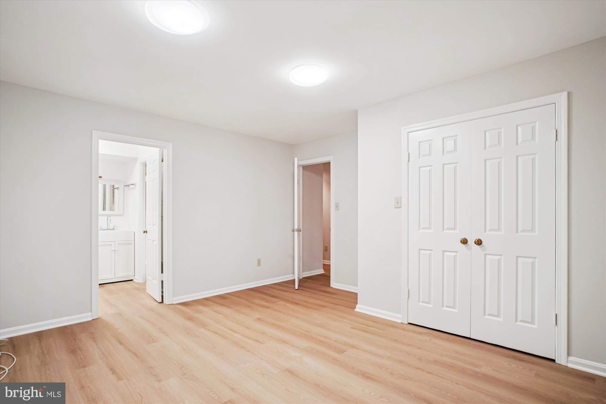 2697 Marcey Road Arlington, VA 22207 - Photo 44 of 64 an empty room with wooden floor & closet area