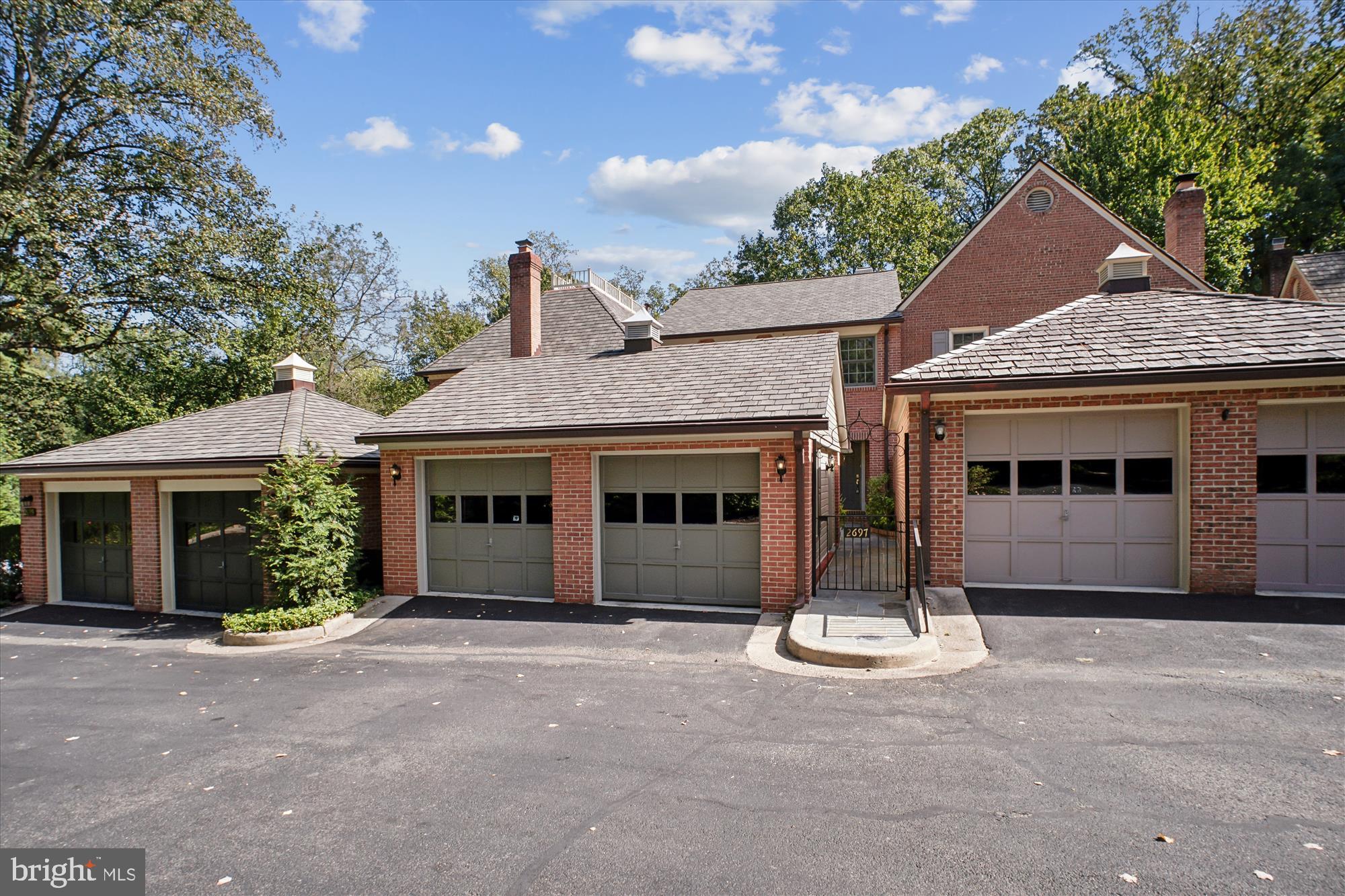 2697 Marcey Road Arlington, VA 22207 - Photo 57 of 64 a front view of a house with a yard and garage