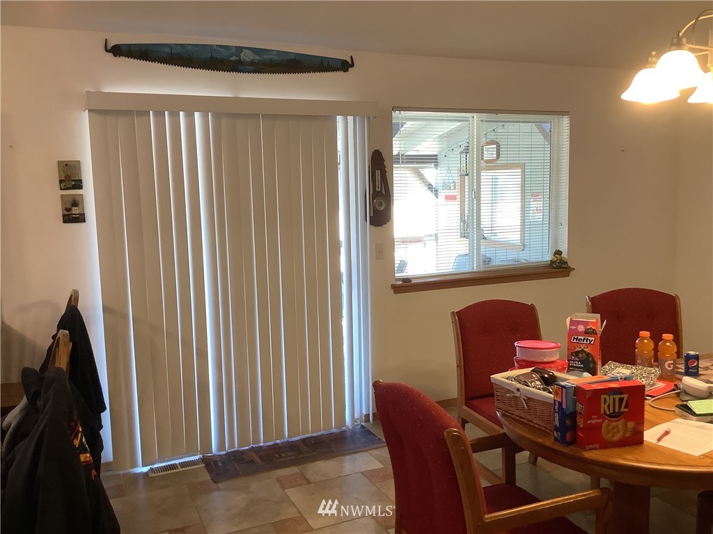 9323 180th Way Southwest Rochester, WA 98579 - Photo 13 of 33 a dining room with furniture and window