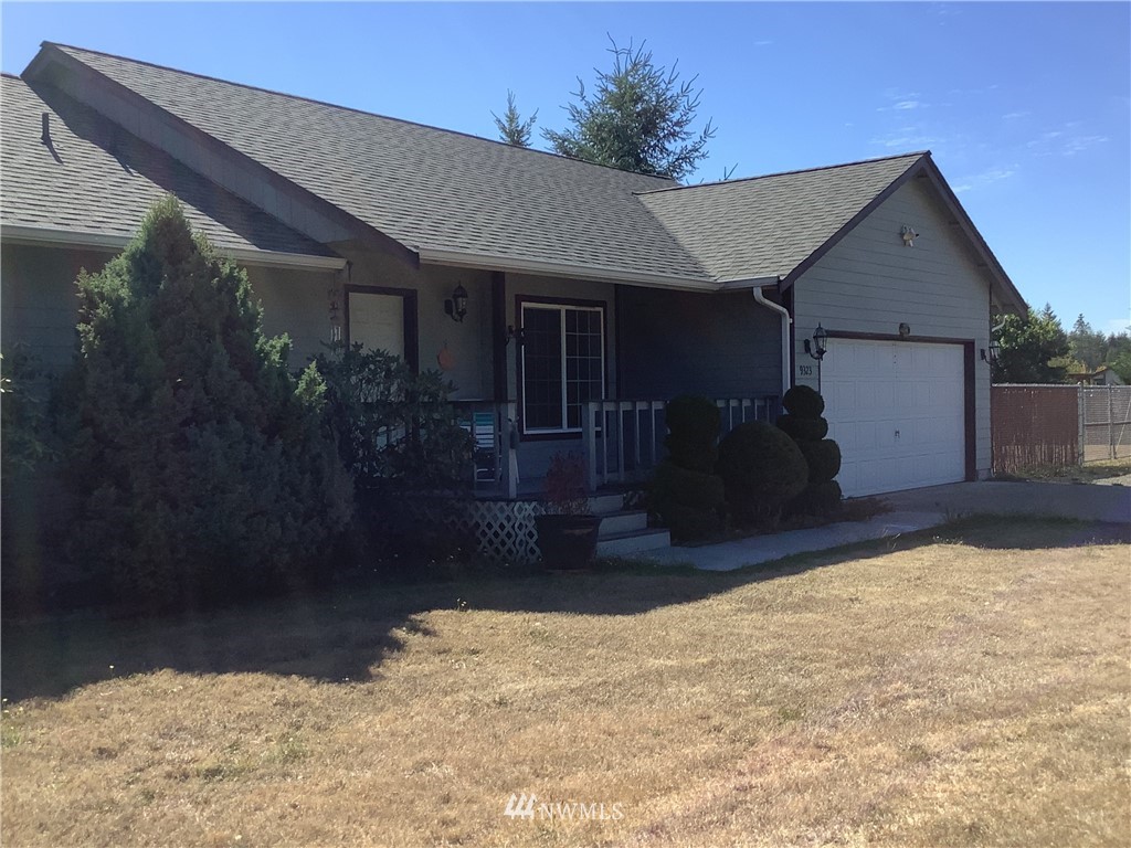 9323 180th Way Southwest Rochester, WA 98579 - Photo 2 of 33 a front view of house with yard