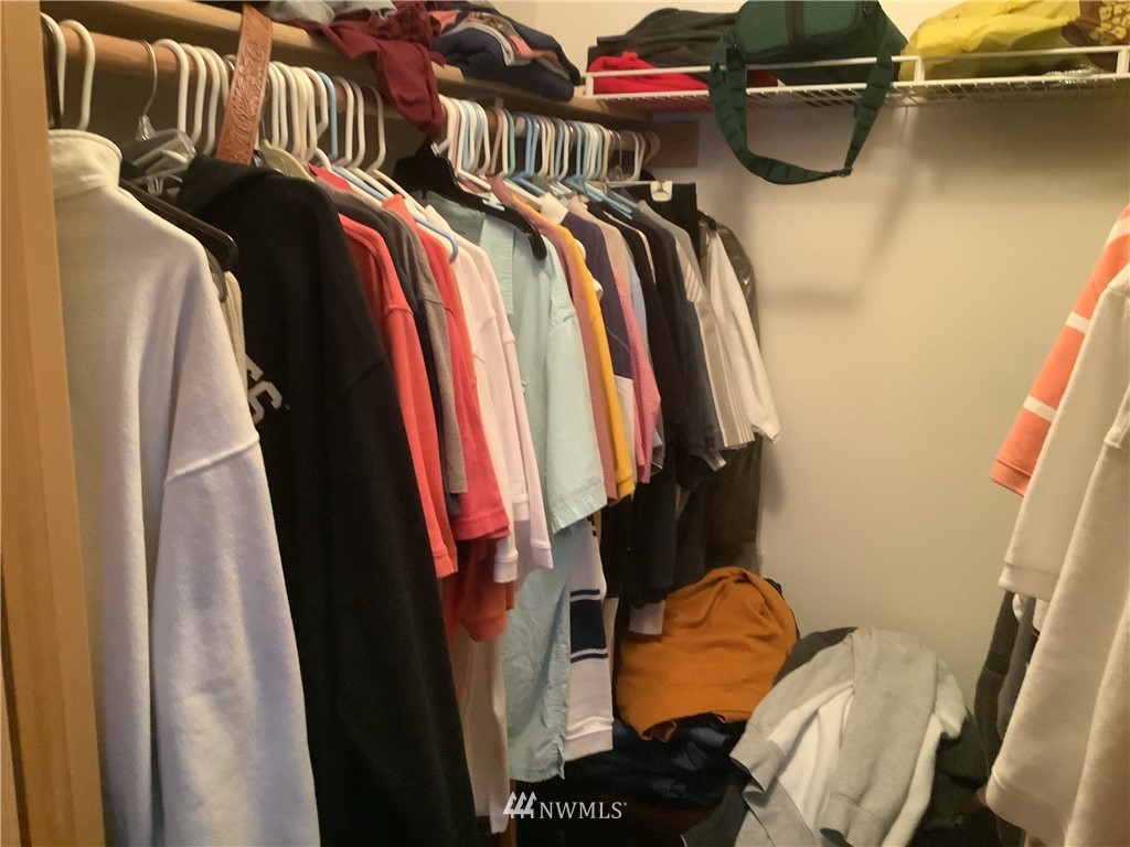 9323 180th Way Southwest Rochester, WA 98579 - Photo 21 of 33 a view of walk in closet with clothes and shoes