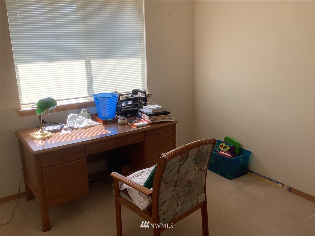 9323 180th Way Southwest Rochester, WA 98579 - Photo 22 of 33 a room with a desk and a window