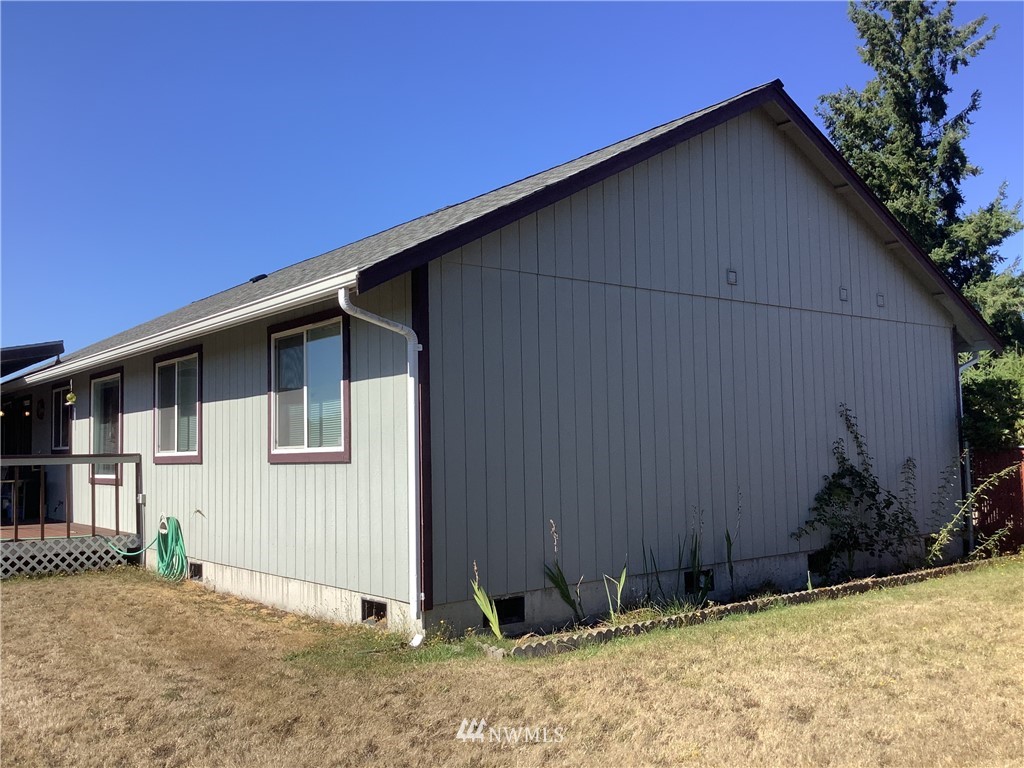 9323 180th Way Southwest Rochester, WA 98579 - Photo 32 of 33 a backyard of a house