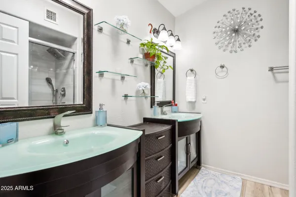 a bathroom with a sink and a mirror