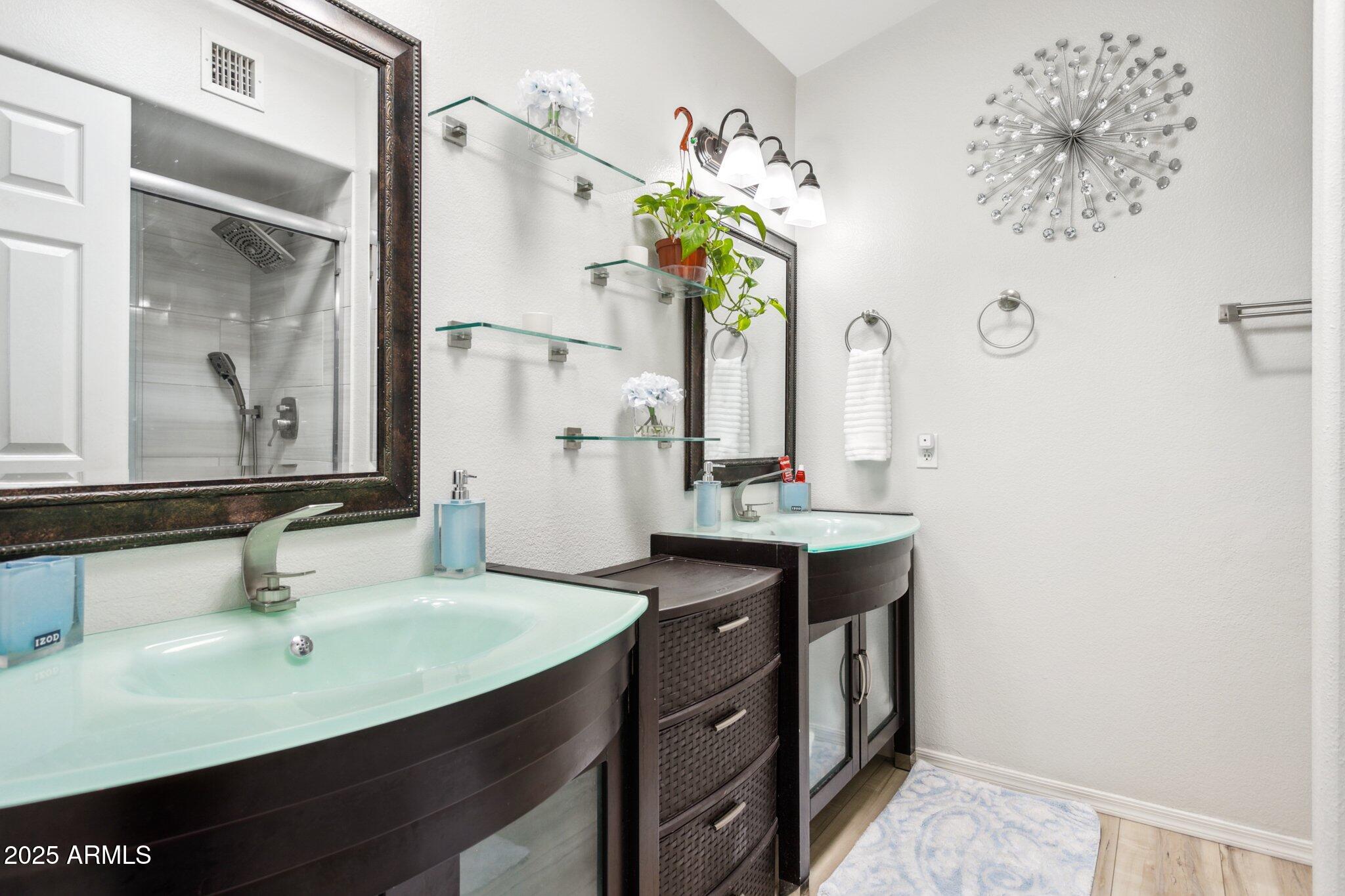 170 East Guadalupe Road, Unit 152 Gilbert, AZ 85234 - Photo 15 of 29 a bathroom with a sink and a mirror