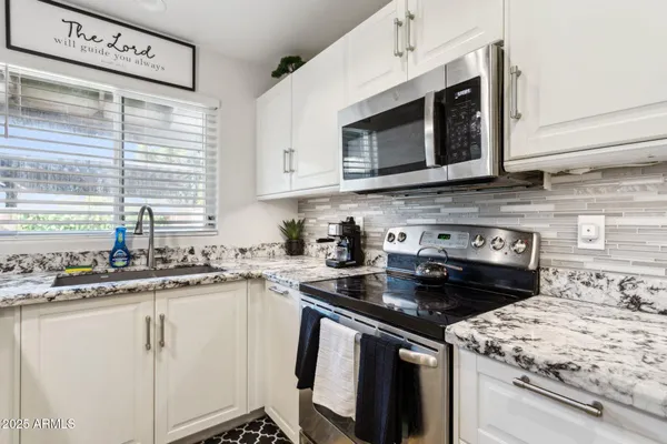 a kitchen with a stove and a microwave
