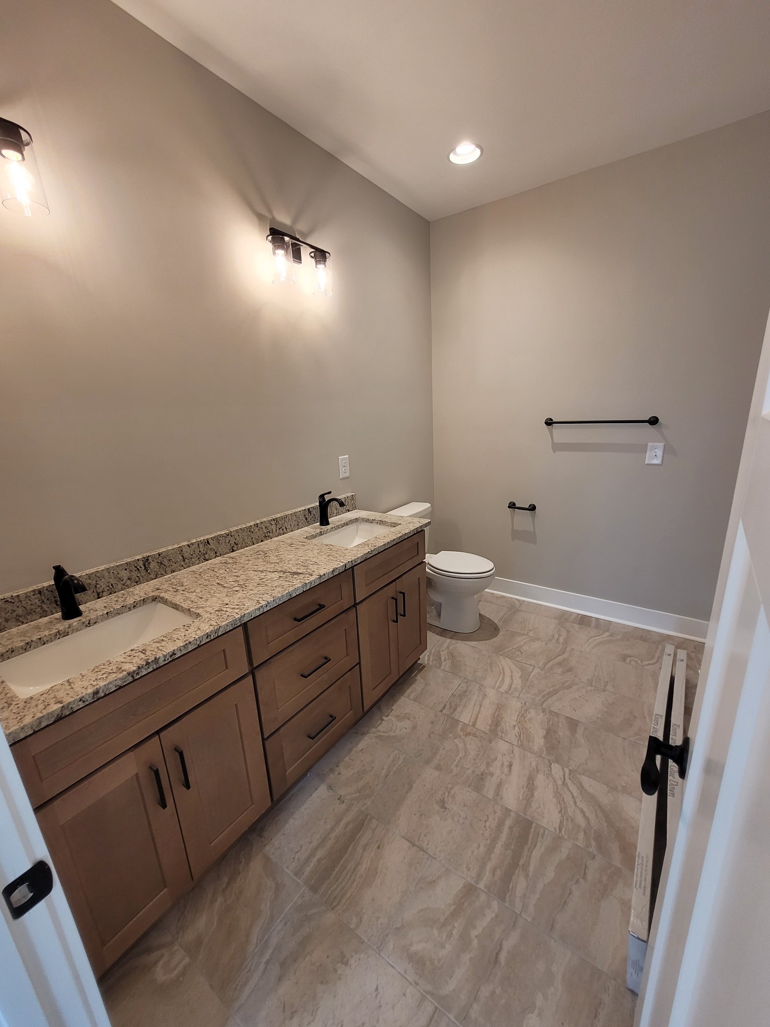 404 Cottage Lane Dickson, TN 37055 - Photo 11 of 35 a spacious bathroom with a granite countertop sink a toilet and a mirror