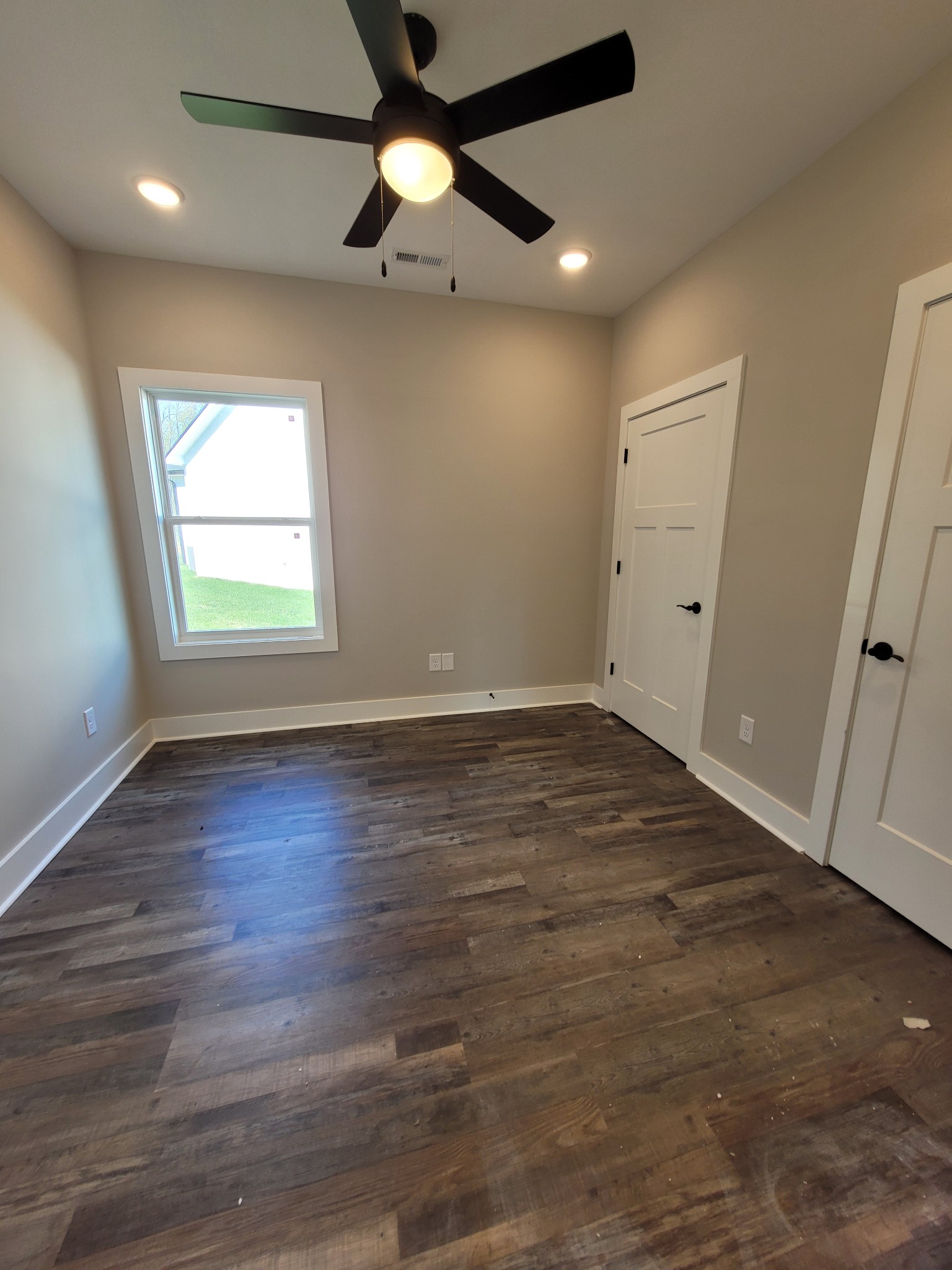 404 Cottage Lane Dickson, TN 37055 - Photo 16 of 35 an empty room with wooden floor and windows