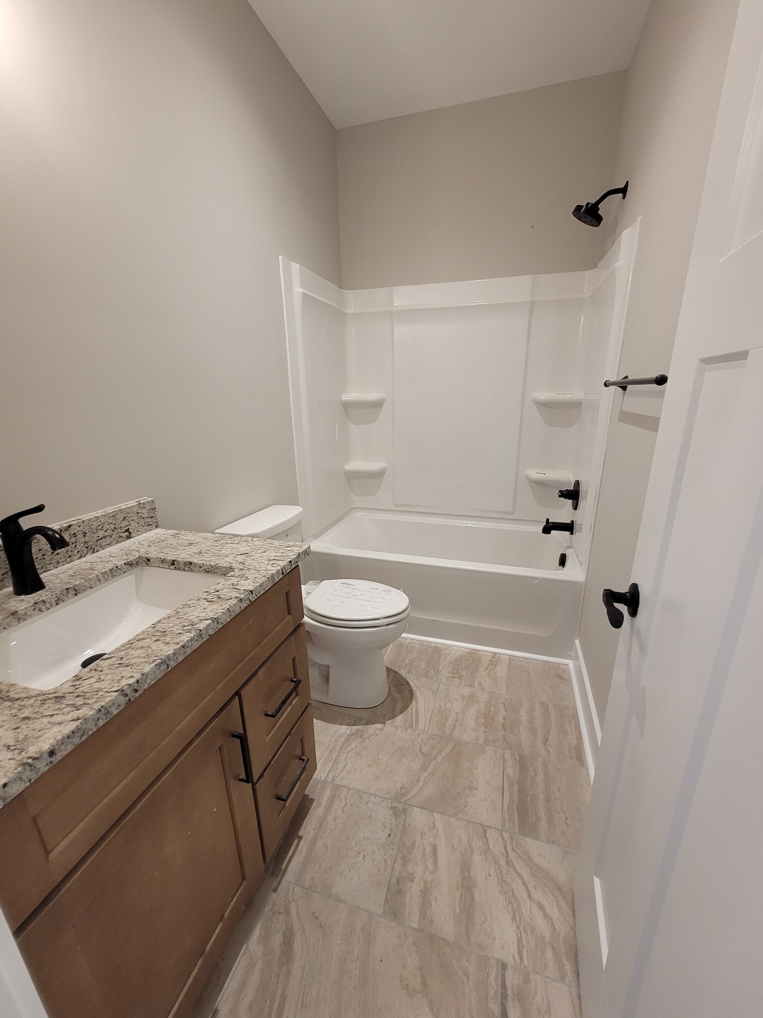 404 Cottage Lane Dickson, TN 37055 - Photo 18 of 35 a bathroom with a granite countertop sink a toilet and shower