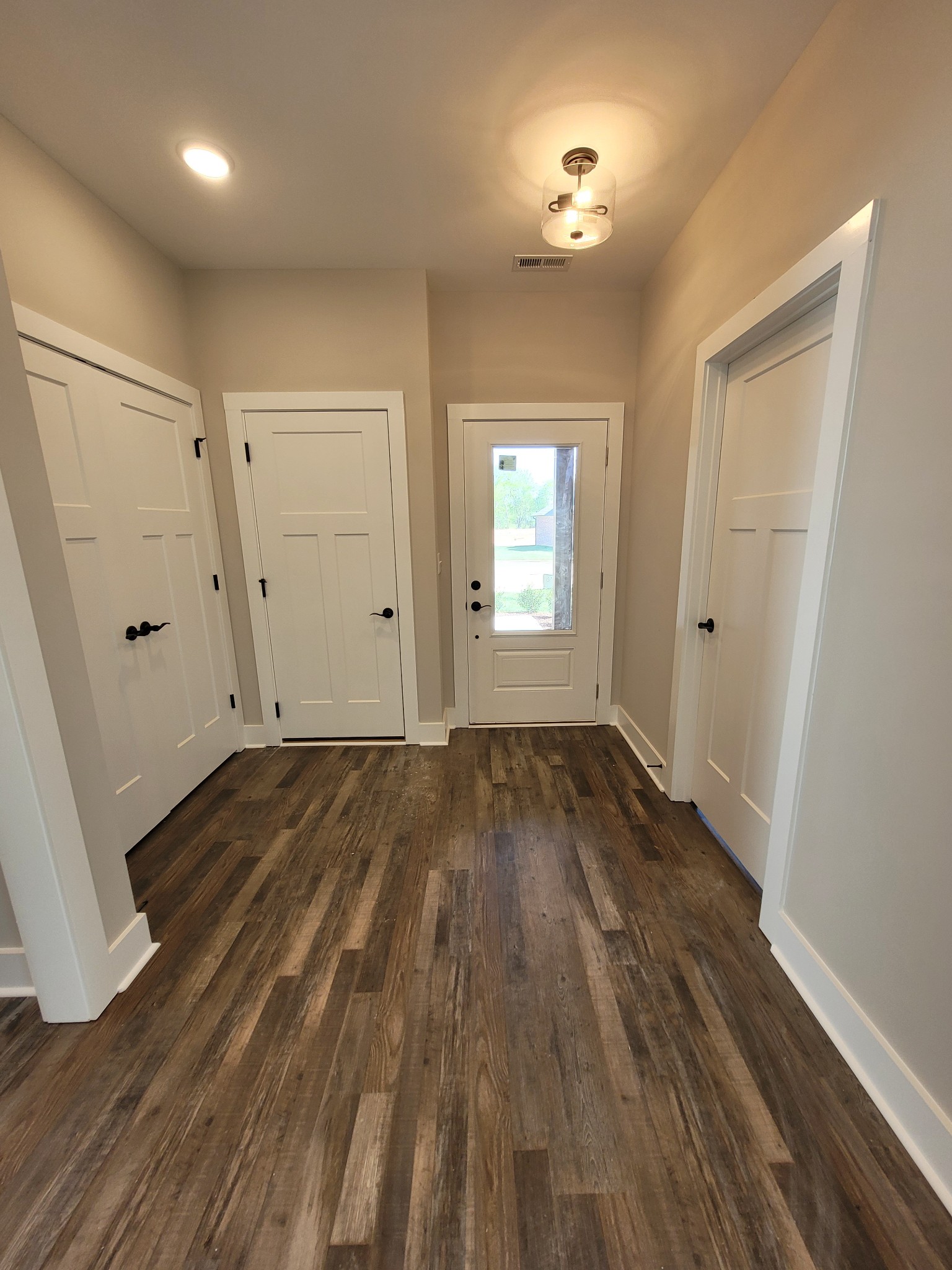 404 Cottage Lane Dickson, TN 37055 - Photo 22 of 35 an empty room with wooden floor and windows