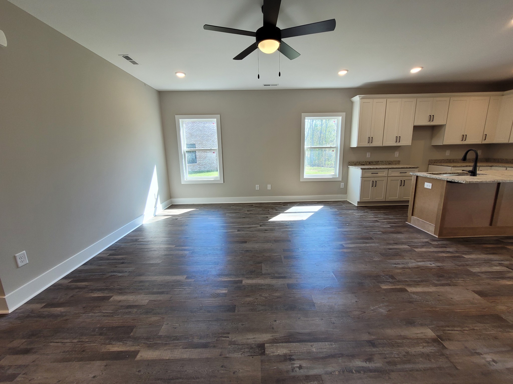 404 Cottage Lane Dickson, TN 37055 - Photo 5 of 35 a kitchen with stainless steel appliances granite countertop a stove top oven a sink dishwasher and a refrigerator with wooden floor