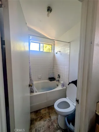 a bathroom with a toilet sink and bathtub