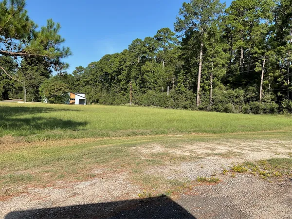 a view of a lake with a yard